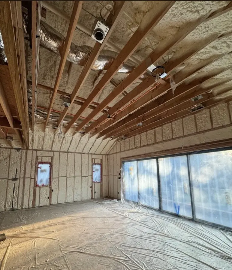 Interior walls and ceiling insulated with spray foam during new construction in Aubrey
